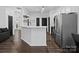 Modern kitchen with stainless steel appliances and dark hardwood floors at 216 Devon Forest Dr, Mooresville, NC 28115