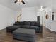 Bright living room with L-shaped sofa and hardwood floors at 216 Devon Forest Dr, Mooresville, NC 28115