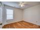 Bright bedroom with hardwood floors and window blinds at 2306 6Th Nw Ave, Hickory, NC 28601