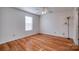 Well-lit bedroom with hardwood floors and ceiling fan at 2306 6Th Nw Ave, Hickory, NC 28601