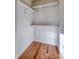 Walk-in closet with wood floors and shelving at 2306 6Th Nw Ave, Hickory, NC 28601