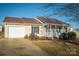 House exterior showcasing a carport and landscaping at 2306 6Th Nw Ave, Hickory, NC 28601