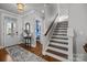 Bright entryway with hardwood floors, staircase, and powder room at 440 Luray Way, Rock Hill, SC 29730