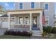 Inviting front porch with seating and American flag at 440 Luray Way, Rock Hill, SC 29730