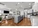 Modern kitchen with white cabinets, gray island, and stainless steel appliances at 440 Luray Way, Rock Hill, SC 29730