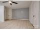 Living room featuring light gray accent wall and vinyl flooring at 4601 Coronado Dr # C, Charlotte, NC 28212