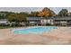 Community swimming pool with surrounding patio area at 4601 Coronado Dr # C, Charlotte, NC 28212