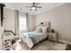 Secondary bedroom with wood headboard and window at 6235 Scuttle Ln, Denver, NC 28037