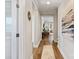 Bright and airy hallway with hardwood floors and art at 6235 Scuttle Ln, Denver, NC 28037