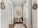 Bright hallway with decorative accents and hardwood floors at 6235 Scuttle Ln, Denver, NC 28037