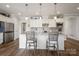 Spacious kitchen with an abundance of white cabinets and granite countertops at 6235 Scuttle Ln, Denver, NC 28037