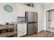 Sleek kitchen with stainless steel refrigerator and white cabinetry at 6235 Scuttle Ln, Denver, NC 28037