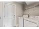 Convenient laundry room with washer, dryer, and ample shelving at 6235 Scuttle Ln, Denver, NC 28037