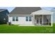 The house features a screened porch, two windows, green lawn, and air conditioner unit at 885 Exeter Dr, Sherrills Ford, NC 28673