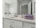 A white-cabinet bathroom boasts a quartz countertop and satin nickel faucet at 885 Exeter Dr, Sherrills Ford, NC 28673