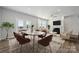 Bright dining area connected to a comfortable living room, featuring modern decor and ample natural light at 885 Exeter Dr, Sherrills Ford, NC 28673