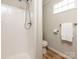 This bathroom has a tiled shower, toilet and glass block window providing natural light to the space at 1411 Lineberger Ave, Gastonia, NC 28052