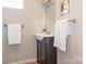 Cozy bathroom featuring a modern vanity with sleek fixtures and a decorative mirror for a touch of elegance at 1411 Lineberger Ave, Gastonia, NC 28052