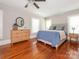 A bright bedroom featuring hardwood floors and neutral decor at 1411 Lineberger Ave, Gastonia, NC 28052