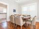 Inviting dining room featuring hardwood floors, neutral paint, and large window at 1411 Lineberger Ave, Gastonia, NC 28052