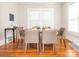 Inviting dining room featuring hardwood floors, neutral paint, and large window at 1411 Lineberger Ave, Gastonia, NC 28052