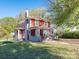 Charming two-story home with a covered front porch and mature landscaping at 1411 Lineberger Ave, Gastonia, NC 28052