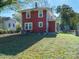 View of the home's exterior, showcasing its architecture, windows, and a well-maintained yard at 1411 Lineberger Ave, Gastonia, NC 28052