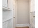 A hallway featuring a built-in cabinet and a door leading outside at 1411 Lineberger Ave, Gastonia, NC 28052