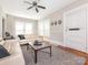 Inviting living room featuring hardwood floors, neutral paint, and a ceiling fan at 1411 Lineberger Ave, Gastonia, NC 28052