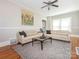 Inviting living room featuring hardwood floors, neutral paint, and a ceiling fan at 1411 Lineberger Ave, Gastonia, NC 28052