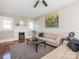 Inviting living room featuring hardwood floors, neutral paint, and a ceiling fan at 1411 Lineberger Ave, Gastonia, NC 28052