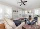Inviting living room featuring hardwood floors, neutral paint, and a ceiling fan at 1411 Lineberger Ave, Gastonia, NC 28052