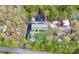 Overhead view of the home showing the landscaping, patio, detached structures and dense trees at 2164 Mission Rd, York, SC 29745