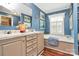 Stylish bathroom with a double vanity, soaking tub, and ample storage, offering a relaxing and functional space at 2164 Mission Rd, York, SC 29745