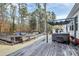 Expansive outdoor deck featuring a hot tub, patio seating, and scenic wooded views at 2164 Mission Rd, York, SC 29745