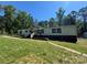 Inviting single-story home with a lush front yard and quaint walkway, perfect for outdoor enjoyment at 2164 Mission Rd, York, SC 29745