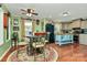 Eat-in kitchen area featuring a charming table and chairs, adjacent to modern kitchen with island at 2164 Mission Rd, York, SC 29745
