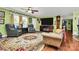 Inviting living room with a large TV, comfortable seating, and plenty of natural light at 2164 Mission Rd, York, SC 29745
