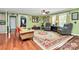 Spacious living room with a decorative rug, cozy seating, and ample natural light at 2164 Mission Rd, York, SC 29745
