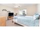 Bedroom with TV, ceiling fan and backyard view at 4700 Aldersbrook Dr, Monroe, NC 28110