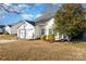 White house with two-car garage and manicured lawn at 4700 Aldersbrook Dr, Monroe, NC 28110