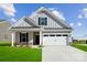 Charming single-story home with vertical siding, an attached two-car garage, and a well-manicured lawn at 8364 Acadia Pkwy, Sherrills Ford, NC 28673