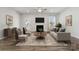 Inviting living room with a fireplace, stylish decor, and plenty of natural light at 8364 Acadia Pkwy, Sherrills Ford, NC 28673