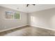 Spacious bedroom with hardwood floors and a large window at 9001 Vicksburg Rd, Charlotte, NC 28227