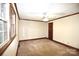 Bright bedroom with large windows, neutral carpet and white walls, trim and ceiling fan at 206 Swaim Ct, Salisbury, NC 28147