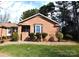 Charming brick home featuring a well-maintained lawn and manicured shrubbery at 206 Swaim Ct, Salisbury, NC 28147