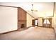 Spacious living room with a brick fireplace, carpeted floor, and natural light at 206 Swaim Ct, Salisbury, NC 28147