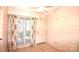 Bright sunroom featuring tiled floors, floral curtains, and a ceiling fan at 206 Swaim Ct, Salisbury, NC 28147