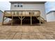 A raised wooden deck with stairs descends into the backyard at 2387 Trundle Dr # Cwo0155, Gastonia, NC 28054