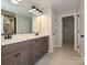 Modern bathroom featuring a double sink vanity, tile floor, and a doorway to the closet at 2387 Trundle Dr # Cwo0155, Gastonia, NC 28054